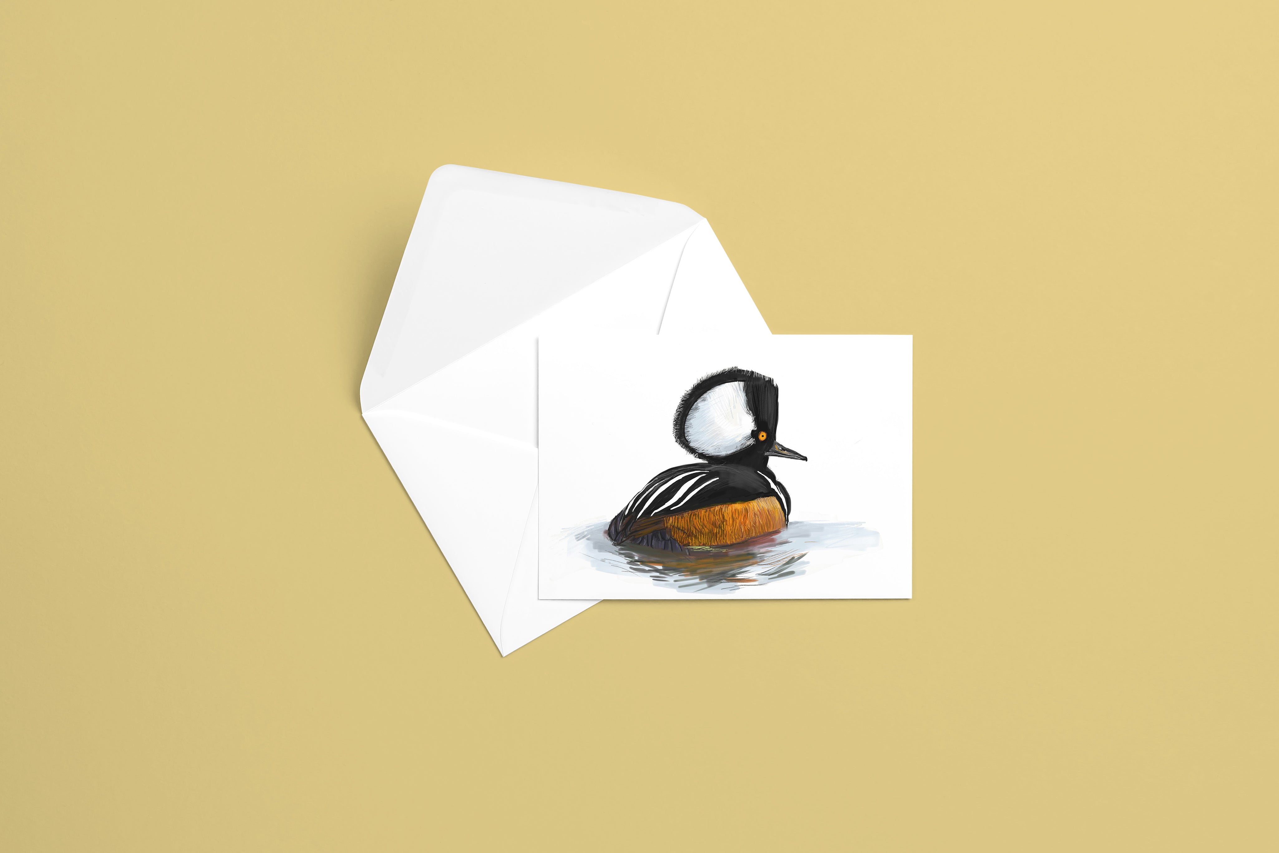 resetreality_greetingcard_hooded-merganser_mockup.jpg